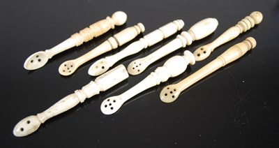 Lot 317 - A group of eight Scottish bone snuff spoons of...