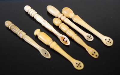 Lot 321 - A group of six Scottish bone snuff spoons of...