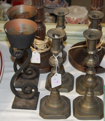 Lot 320 - Four brass candlesticks together with two cast-...