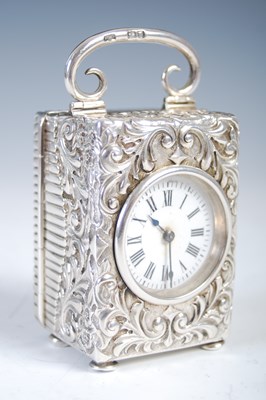 Lot 185 - A late 19th century silver carriage clock, the...