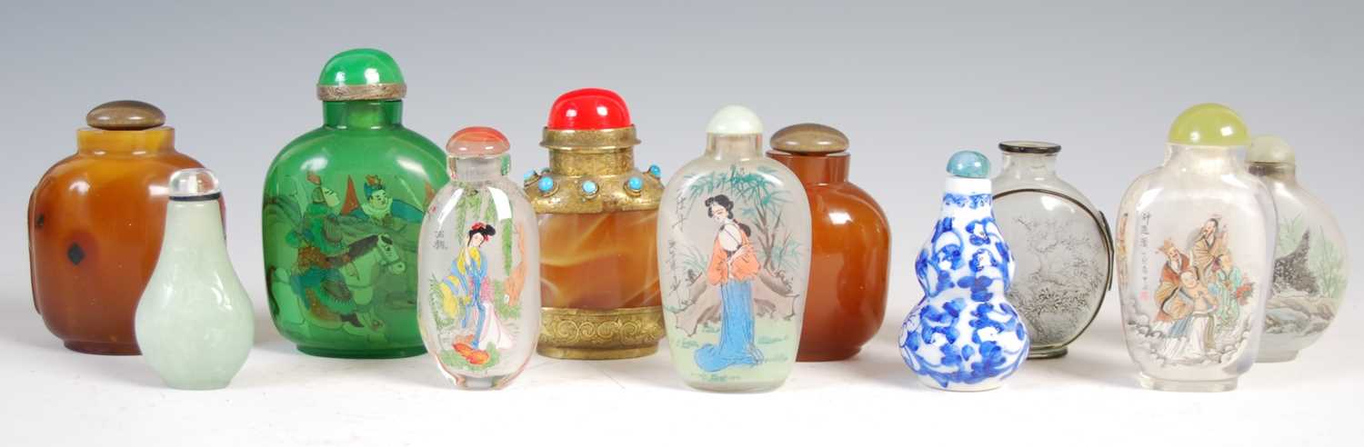 Lot 591 - A collection of eleven Chinese snuff bottles,...