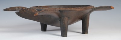 Lot 150 - A Fijian carved wood kava bowl formed as a...