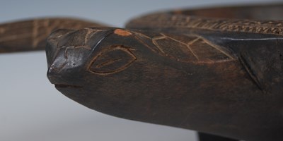Lot 150 - A Fijian carved wood kava bowl formed as a...
