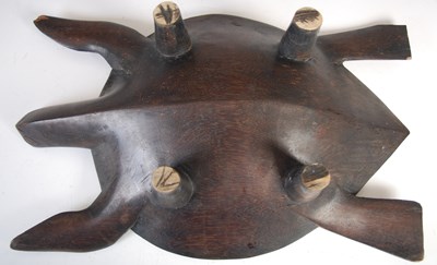 Lot 150 - A Fijian carved wood kava bowl formed as a...