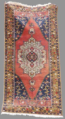 Lot 979 - A Turkish long rug, 20th century, the...