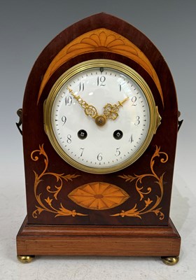 Lot 390 - An Edwardian inlaid mahogany mantle clock of...