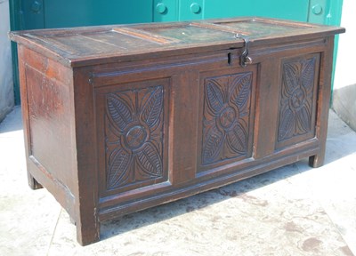 Lot 915 - A George III oak coffer, the triple panel...