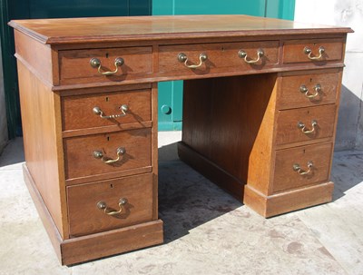 Lot 785 - A late 19th century oak pedestal desk, the...