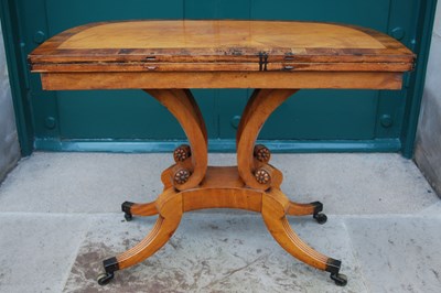 Lot 15 - A 19th century satinwood and yew wood tea...