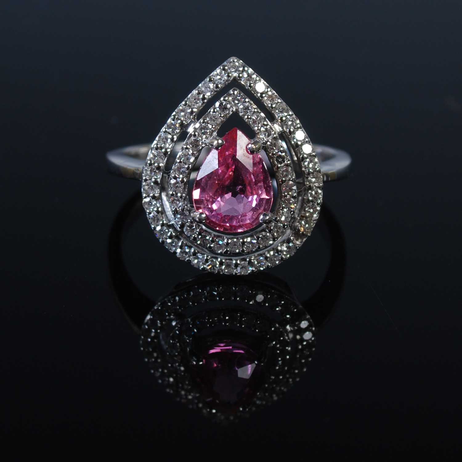 Lot 41 - An 18ct gold Padparadscha colour sapphire and...
