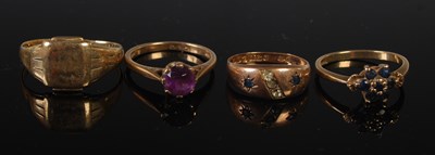 Lot 48 - A group of four 9ct gold rings to include a...