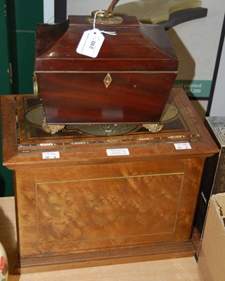 Lot 240 - A mahogany tea caddy with brass accents...