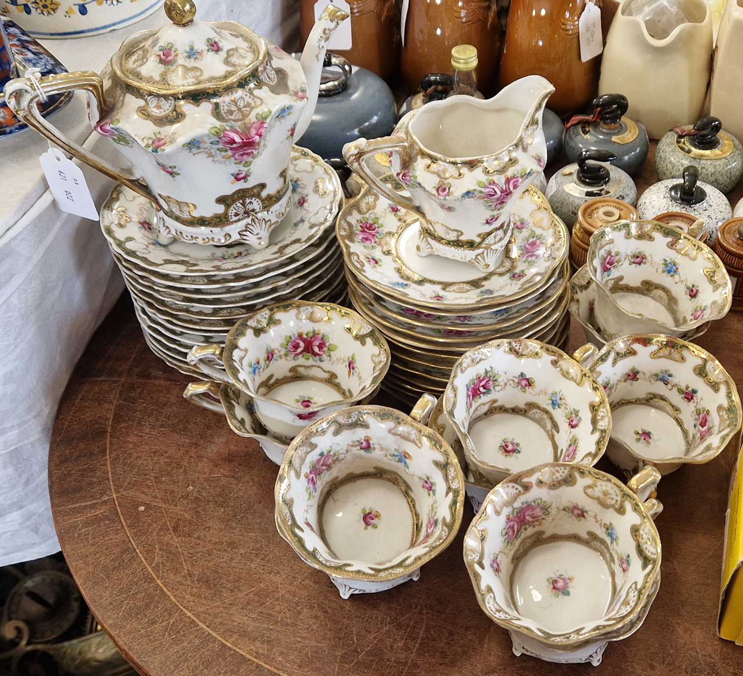 Lot 521 - An antique porcelain hand-painted part tea