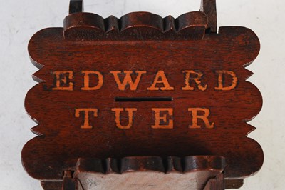 Lot 98 - A mahogany puzzle money bank inscribed ‘Edward...