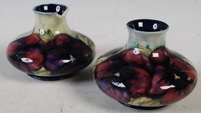 Lot 35 - A pair of Moorcroft pottery vases decorated...