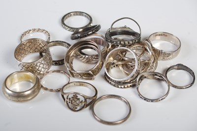 Lot 343 - Fifteen assorted silver and white metal rings.