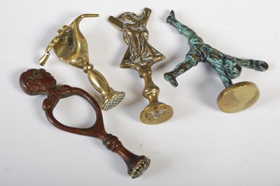 Lot 336 - Four assorted antique brass pipe tampers, to...