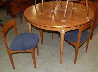 Lot 634 - A mid-century teak dining room suite...