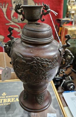 Lot 363 - A Japanese bronze twin handled urn & cover...