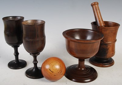 Lot 304 - A collection of treen ware to include a...