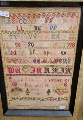 Lot 692 - A Victorian needlework sampler, worked in...