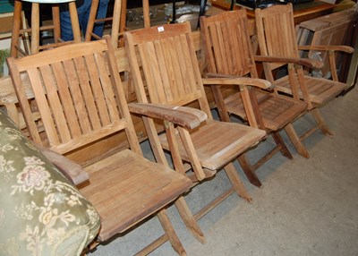 Lot 641 - A garden drop leaf table and four folding...