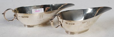 Lot 125 - A pair of Edward VIII silver sauceboats,...