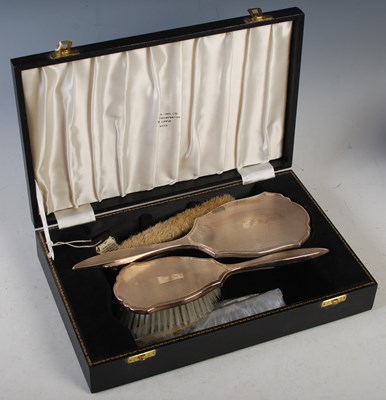 Lot 174 - A cased Birmingham silver three piece dressing...