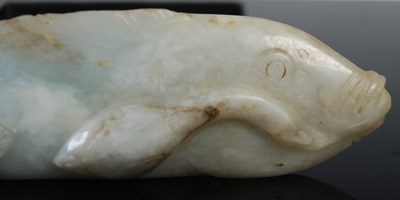 Lot 243 - A Chinese jade model of a fish and fingerlings,...