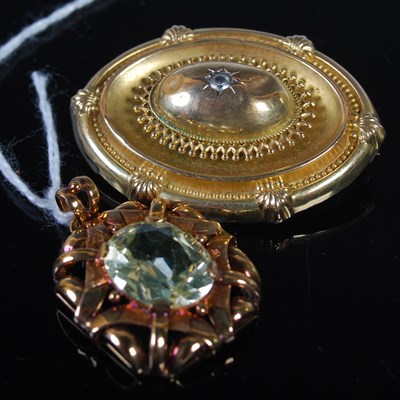 Lot 249 - A yellow metal pendant set with pale peridot...