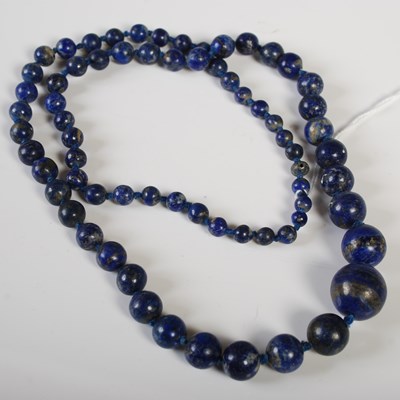 Lot 242 - A vintage lapis lazuli graduated ball necklace,...