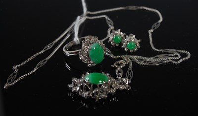 Lot 224 - A suite of white metal green stone and paste...