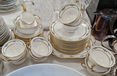 Lot 456 - An Aynsley china part tea set with black...