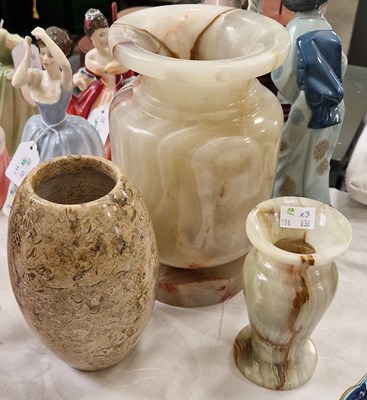 Lot 425 - Three stone vases, to include a vase with...