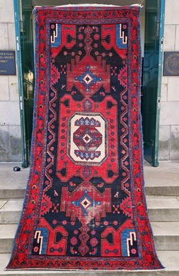 Lot 995 - A Persian long rug, 20th century, the charcoal...