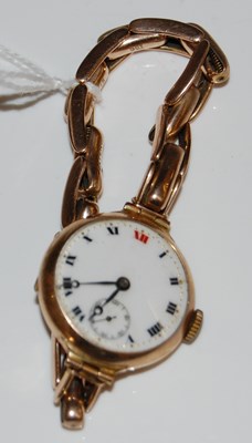 Lot 22 - A vintage 9ct gold cased wristwatch with black...