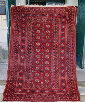 Lot 996 - A Persian Tekke rug, the rectangular madder...