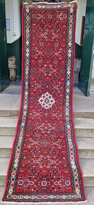 Lot 997 - A Persian runner, 20th century, the madder...