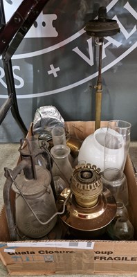 Lot 594 - A box of assorted paraffin lamps and components.