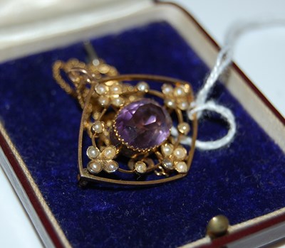 Lot 60 - A yellow metal, split pearl and amethyst oval...