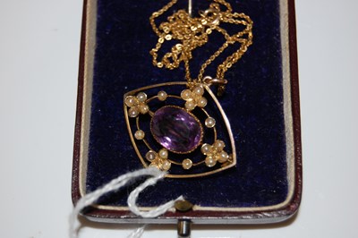 Lot 60 - A yellow metal, split pearl and amethyst oval...