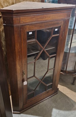 Lot 967 - A Georgian mahogany hanging corner cupboard...