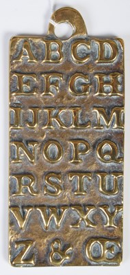 Lot 303 - An antique brass alphabet plaque teaching aid,...