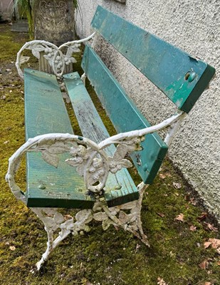 Lot 894 - A cast iron and wood garden bench, the ends...