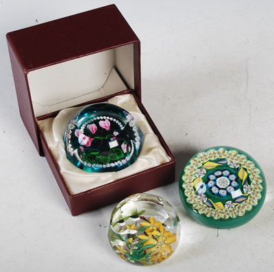 Lot 349 - Three assorted millefiori glass paperweights...