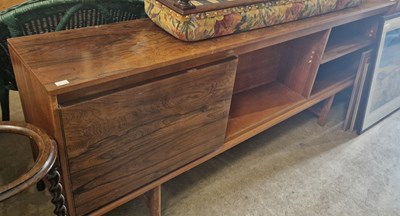 Lot 879 - A rosewood side cabinet with two open recesses...