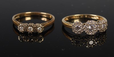 Lot 310 - A gold and diamond chip three stone ring, size...