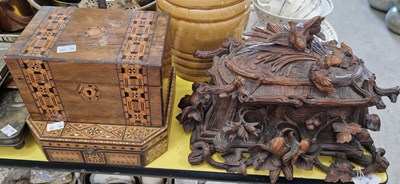 Lot 555 - A late 19th century Black Forest carved wood...