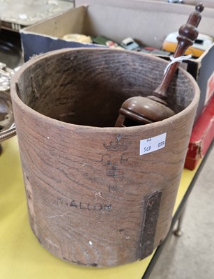 Lot 559 - A cylindrical wooden tub containing assorted...