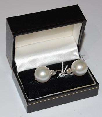 Lot 46 - A pair of Art Deco style white metal, pearl...